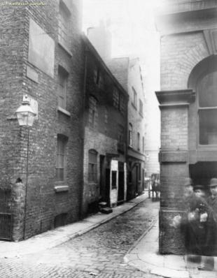 A photograph taken in 1892 showing the corner of Union Street and the little alley running off it known as Church Lane. I love this photograph because the man and woman walked into the shot mid-exposure, so they appear twice. However because they were moving there is a translucent, ghost-like quality to their image. (Source: M01696, E. Ireland, 1892, http://images.manchester.gov.uk/index.php?session=pass)